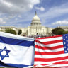 AMERICAN AND ISRAELI flags fly during a demonstration in support of Israel at the US Capitol in 2002.