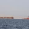 A tugboat moves cargo towards the Strait of Hormuz off the coast of Musandam province, Oman, July 20, 2018