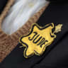 Polish born Mordechai Fox, an 89-year-old Holocaust survivor, wears a yellow Star of David on his jacket during a ceremony marking Holocaust Remembrance Day