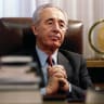 THE LATE Shimon Peres at his desk in 1994. 