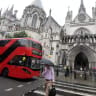 A London bus is driven past The Royal Courts of Justice in London, Britain, July 30, 2019