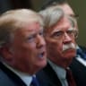 United States President Donald Trump pictured next to Former United States National Security Advisor John Bolton.
