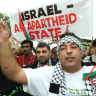  PRO-PALESTINIAN SUPPORTERS demonstrate outside the World Conference Against Racism in Durban, South Africa, in 2001.