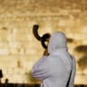  A Jewish worshipper blows a Shofar as he takes part in Slichot at the Western Wall in Jerusalem's Old City, 2017