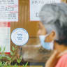  A WOMAN walks past a Jerusalem eatery with a Tzohar kashrut certificate.