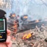  A geiger counter measures a radiation level at a site of fire burning in the exclusion zone around the Chernobyl nuclear power plant, outside the village of Rahivka.