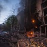  Rescuers work at a site of a residential building damaged by a missile strike, as Russia's attack on Ukraine continues, in Kyiv, Ukraine, in this handout picture released on April 29, 2022.