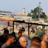  Palestinian workers in Israel strike against Israel and Palestinian Authority's recent agreement to have their wages transferred to bank accounts, at an Israeli checkpoint in Tulkarm in the West Bank, August 21, 2022; Illustrative.