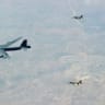  TWO ISRAELI Air Force F-16I fighter jets accompany a US B-52 bomber over Israel as it makes its way to the Gulf.