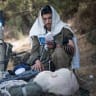  THE ZIONIST identity didn’t overcome the Jewish identity, nor did the opposite occur: An IDF soldier puts on tefillin.