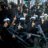  Palestinian gunmen from the Balata Brigade of the Fatah movement carry their weapons during a military parade, in Balata refugee camp, in the West Bank, on November 4, 2022. 