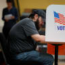 A local resident casts a provisional ballot during the midterm elections at a polling location in Georgia's 14th congressional district represented by U.S. Republican Congresswoman Marjorie Taylor Greene, in Calhoun, Georgia, US, November 8, 2022.