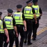 Police are seen at St Giles' Cathedral, Edinburgh, for the National Service of Thanksgiving and Dedication for King Charles III and Queen Camilla, and the presentation of the Honours of Scotland, in Edinburgh, Scotland, July 5, 2023.