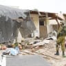  An IDF soldier looks at the destruction in Kibbutz Kfar Aza, one of the hardest-hit communities in the October 7 onslaught by Hamas.