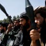  Taliban soldiers celebrate on the second anniversary of the fall of Kabul on a street near the US embassy in Kabul, Afghanistan, August 15, 2023. 