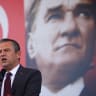  Turkey's main opposition Republican People's Party (CHP) leader Ozgur Ozel, with a poster of modern Turkey's founder Ataturk in the background, speaks during a rally in Istanbul, Turkey, May 18, 2024.