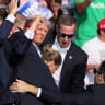  Republican presidential candidate and former U.S. President Donald Trump is assisted by the Secret Service after gunfire rang out during a campaign rally at the Butler Farm Show in Butler, Pennsylvania, US, July 13, 2024.
