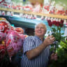  A flower shop owner is seen arranging roses for a customer on Tu B'Av, the Jewish holiday of love, in Jerusalem, on August 15, 2019.