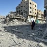  Palestinians view the damage after Israeli forces withdrew from the area around Kamal Adwan hospital, amid the ongoing Israel-Hamas conflict, in Jabalya, in the northern Gaza Strip October 26, 2024.