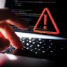  System hacking warning message appears on laptop.