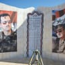  Images of Syria’s Bashar al-Assad and his father, Hafez al-Assad, are riddled with bullet holes as fighters of the ruling Syrian body inspect the damage at a military site, in Damascus on December 14, 2024. 