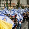Israelis attend a protest march against the decision of Israeli prime minister Benjamin Netanyahu to fire head of Shin Bat Ronen Bar, at the entrance to Jerusalem, March 19, 2025.