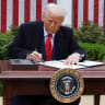 US President Donald Trump signs an executive order on tariffs, in the Rose Garden at the White House in Washington, DC, US, April 2, 2025
