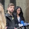 Max Long, one of the allegedly assaulted DePaul students, addresses the media outside Chicago's Cook County Circuit Court, wearing a yellow hostage pin and commemorative dog-tag necklace, April 2, 2025.