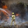 Illustrative: Firefighters try to extinguish a fire which broke out near Moshav Mesilat Zion, April 30, 2025.