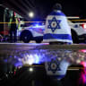 Illustrative: A man looks on next to police officers working at the site where, according to the U.S. Homeland Security Secretary, two Israeli embassy staff were shot dead near the Capital Jewish Museum in Washington, US May 21, 2025.