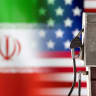  Model of petrol pump is seen in front of US and Iran flag colors in this illustration.