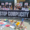 An Italian delegation of political, academic, and human rights figures hold banners and protest during their visit to the Rafah border crossing between Egypt and the Gaza Strip, amid the ongoing conflict in Gaza between Israel and Hamas, in Rafah, Egypt, May 18, 2025.