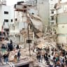  Rescue workers search for survivors and victims in the rubble left after a powerful car bomb destroyed the Buenos Aires headquarters of the Argentine Israeli Mutual Association (AMIA), in this July 18, 1994.