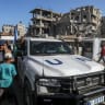 Empty UNRWA and World Food Program trucks head to the Kerem Shalom crossing to collect limited humanitarian aid and fuel, in Khan Yunis, southern Gaza Strip, July 24, 2025