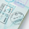 An illustrative image of a passport with stamps from Israel's Ben-Gurion Airport.