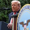 US President Donald Trump delivers a speech during a ceremony marking the 24th anniversary of the September 11, 2001, next to a podium with the emblem of the Department of War.