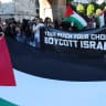 PAOK fans gather in the city center to protest against Maccabi Tel Aviv - Thessaloniki, Greece - September 24, 2025 General view of a Palestine flag as a banner is displayed during the protest reading "your pitch your choice boycott Israel."