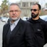 Hezbollah Member of Parliament Ali Fayyad stands in Burj al-Muluk, near the southern Lebanese village of Kfar Kila, where Israeli forces remained on the ground after a deadline for their withdrawal passed as residents sought to return to homes in the border area