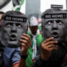 Anti-Israel demonstrators hold cutouts depicting US President Donald Trump’s face as they march towards the US Embassy to protest the president's visit to Malaysia for the Association of Southeast Asian Nations (ASEAN) Summit on Sunday, at Kuala Lumpur, Malaysia, October 24, 2025