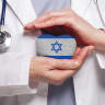 An illustrative image of a doctor holding a heart with an Israeli flag.