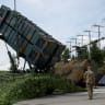 Ukrainian service members walk next to a launcher of a Patriot air defence system, amid Russia's attack on Ukraine, in an undisclosed location, Ukraine August 4, 2024.