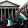 People wave Palestinian flags as they take part in a protest to show support for Palestinians in Gaza, amid the ongoing conflict between Israel and Hamas, near the Pantheon in Rome, Italy, March 20, 2025