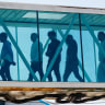 Migrants deported from the United States walk a jet bridge. (Ilustrative)