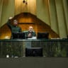 Iranian Parliament Speaker Mohammad-Bagher Ghalibaf looks on as parliament members chant in support of the IRGC while wearing military uniforms in Tehran, Iran, February 1, 2026.