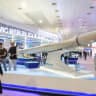 ILLUSTRATIVE: Visitors observe the Iranian Ministry of Defense’s display featuring the Shahed 136 drone during the 13th edition of Iraq’s Defense, Security, and Cybersecurity Exhibition (IQDEX) in Baghdad, Iraq April 19, 2025.