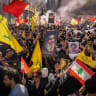 Demonstrators carry portraits of late Hezbollah leader Hassan Nasrallah during a protest against direct negotiations between Israel and Lebanon, in Beirut, Lebanon, April 11, 2026