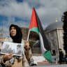 A demonstrator holds a Palestinian flag and a picture of late Iran's supreme leader Ayatollah Ali Khamenei with late Hamas leader Yahya Sinwar, during a protest after Khamenei was killed in Israeli and US strikes, in Istanbul, Turkey, March 1, 2026; illustrative.