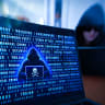 ILLUSTRATION of cybercrime and hacking activity with a laptop displaying a pirate symbol.