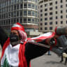 A demonstrator holds empty tear gas canisters during a protest over the deteriorating economic situation, in Riad al-Solh Square in Beirut, Lebanon, in 2023. 