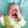 Experts warn that giving the baby a bottle while they are lying down in bed could be far more problematic than it seems